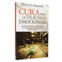 Livro Cura Para Traumas Emocionais, de David A. Seamands, capa branca com título em vermelho e imagem de planta em chão de madeira. — Plenitude