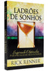 Capa do livro Ladrões de Sonhos, com fundo floral e uma ampulheta no centro. — Plenitude