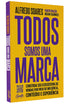 Livro Todos Somos Uma Marca, capa comum, amarelo com título em roxo. — Plenitude