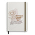 Caderno Moleskine com pauta, capa branca com desenho de girassol e frase. — Plenitude