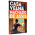 Livro Casa Velha de Machado de Assis, capa com mulher olhando pela janela. — Plenitude