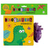 Livro de banho Dinossauros Animados, capa amarela com dinossauro verde e um dinossauro roxo de brinquedo. — Plenitude