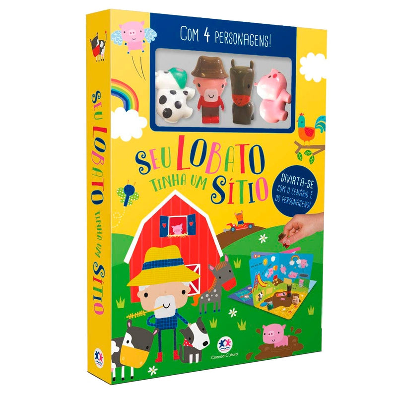 Livro com cenário Seu Lobato Tinha Um Sítio, capa amarela com ilustrações da fazenda e quatro personagens de borracha. — Plenitude