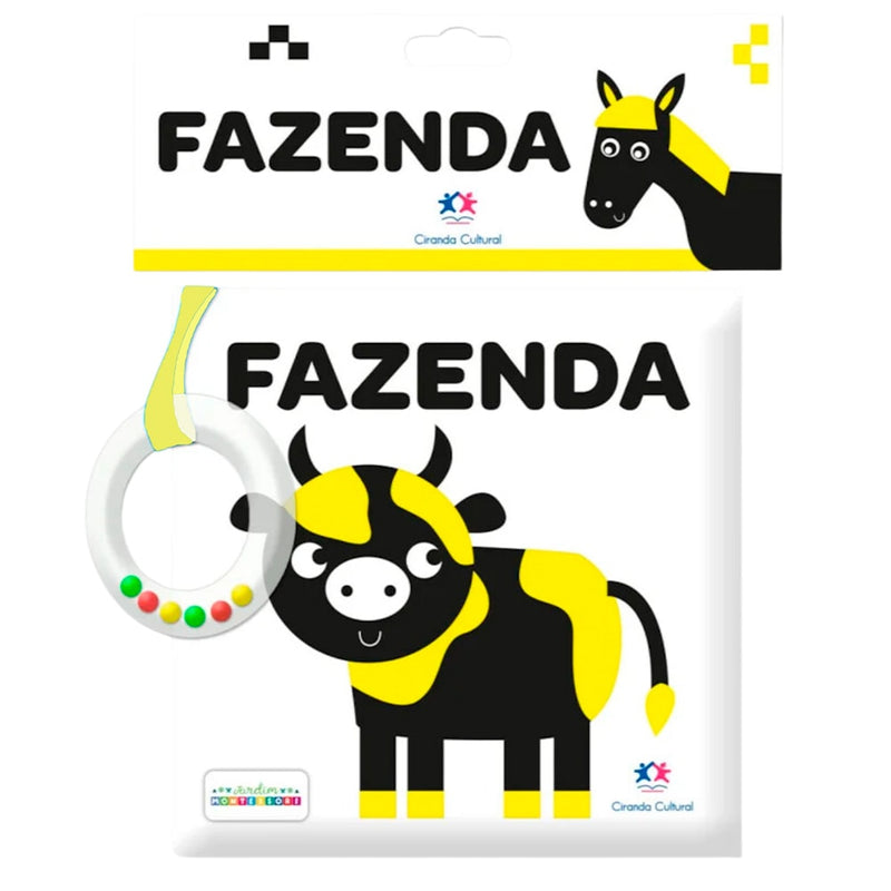 Livro de Pano Fazenda com chocalho, capa amarela e preta com ilustração de vaca. — Plenitude