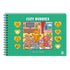 Livro de colorir Cozy Buddies, Comfy Goods, capa verde com urso, raposa e cachorro em sala. — Plenitude