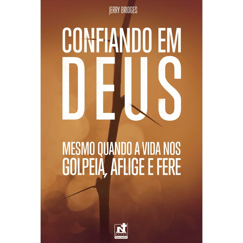 Livro Confiando em Deus, capa laranja com imagem de galho seco e título em branco. — Plenitude