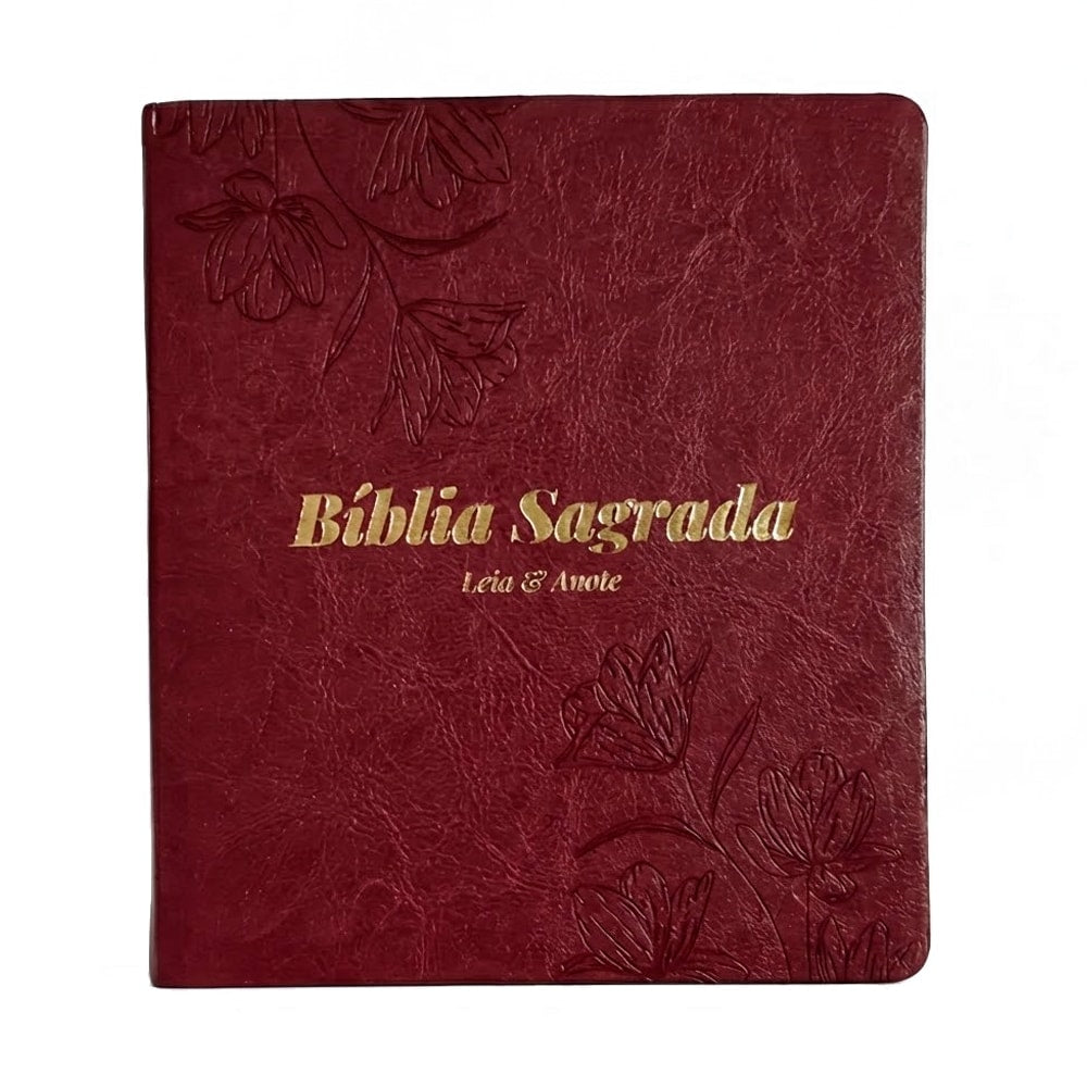 Bíblia Sagrada NVI, capa luxo vinho com detalhes florais em relevo e "Leia & Anote" em dourado. — Plenitude