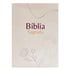 Bíblia Sagrada NVA, capa brochura bege com flores e folhas em tons pastel. — Plenitude